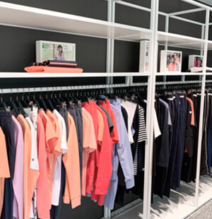 Showroom with product carriers and numerous collection items from the Scoretex Home of Brands brands.