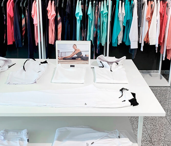 Showroom with product carriers and numerous collection items from the Scoretex Home of Brands brands.