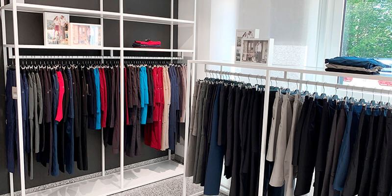 Showroom with product carriers and numerous collection items from the Scoretex Home of Brands brands.