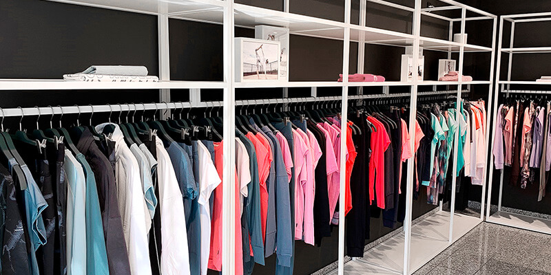 Showroom with product carriers and numerous collection items from the Scoretex Home of Brands brands.