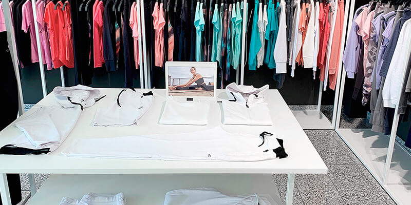 Showroom with product carriers and numerous collection items from the Scoretex Home of Brands brands.